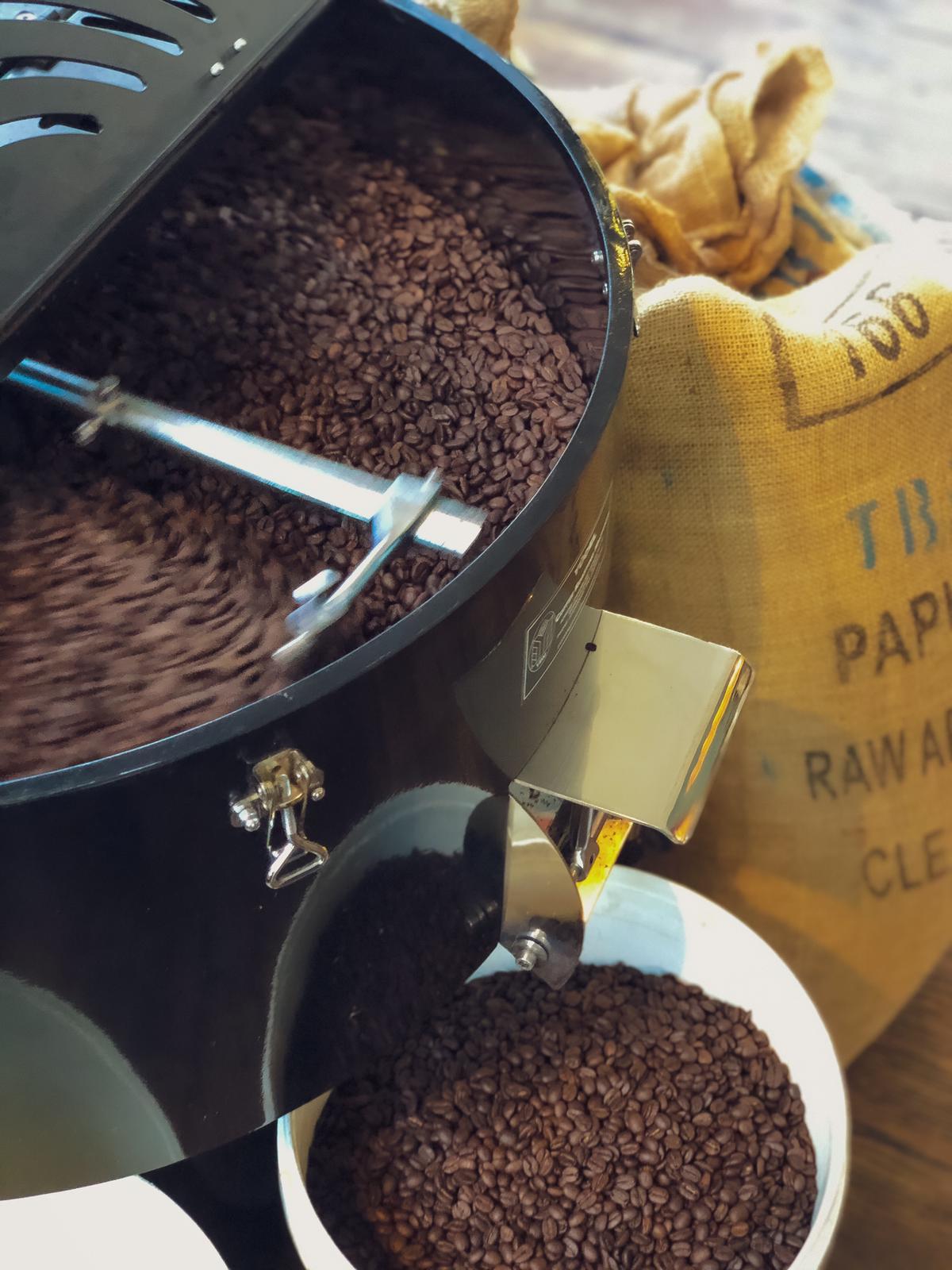 Freshly roasted coffee beans cooling in a commercial Yucel coffee roaster