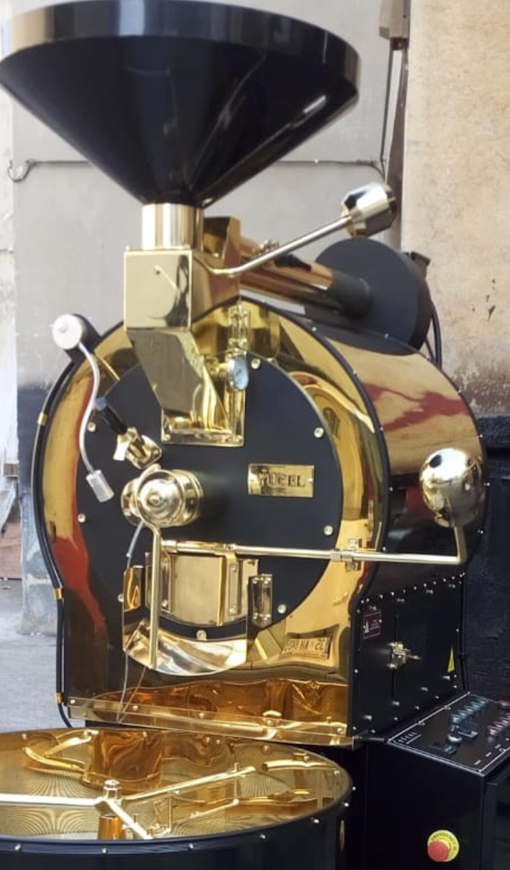 Yucel coffee roasting machine with black and brass finish combining tradition and modern design for cafes and commercials