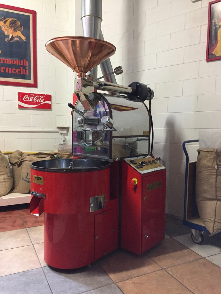 Commercial Turkish Yucel coffee roaster in red with copper hopper and stainless steel body for cafés and roasteries